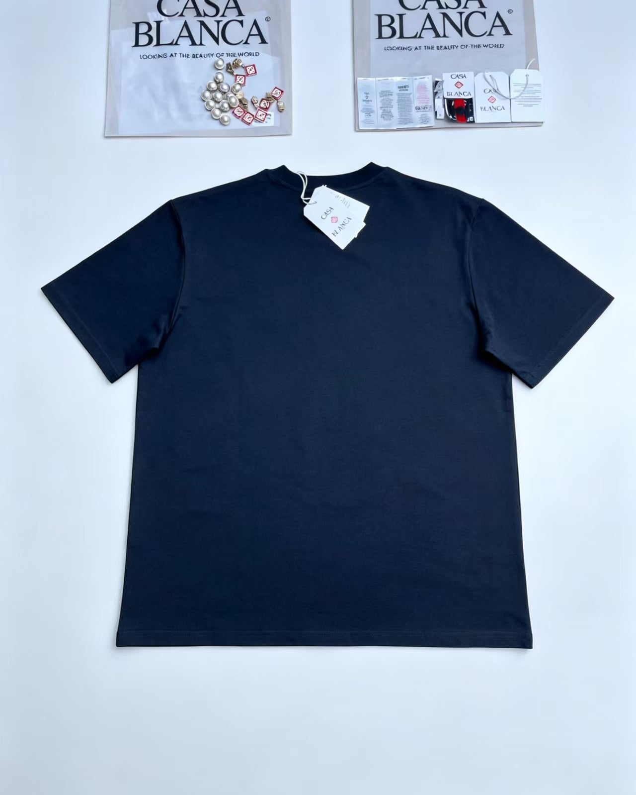 Casa - Tropical Island Triangle Black Tee